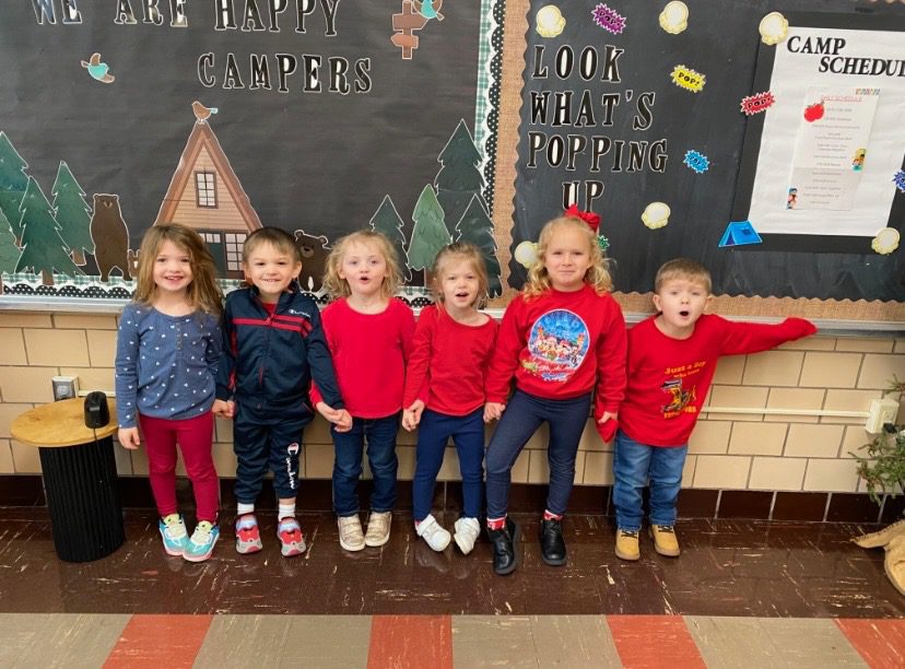 group photo of preschool kids dressed in colors of red, white, and blue standing in front of a chalkboard at Galion St Joseph Catholic School