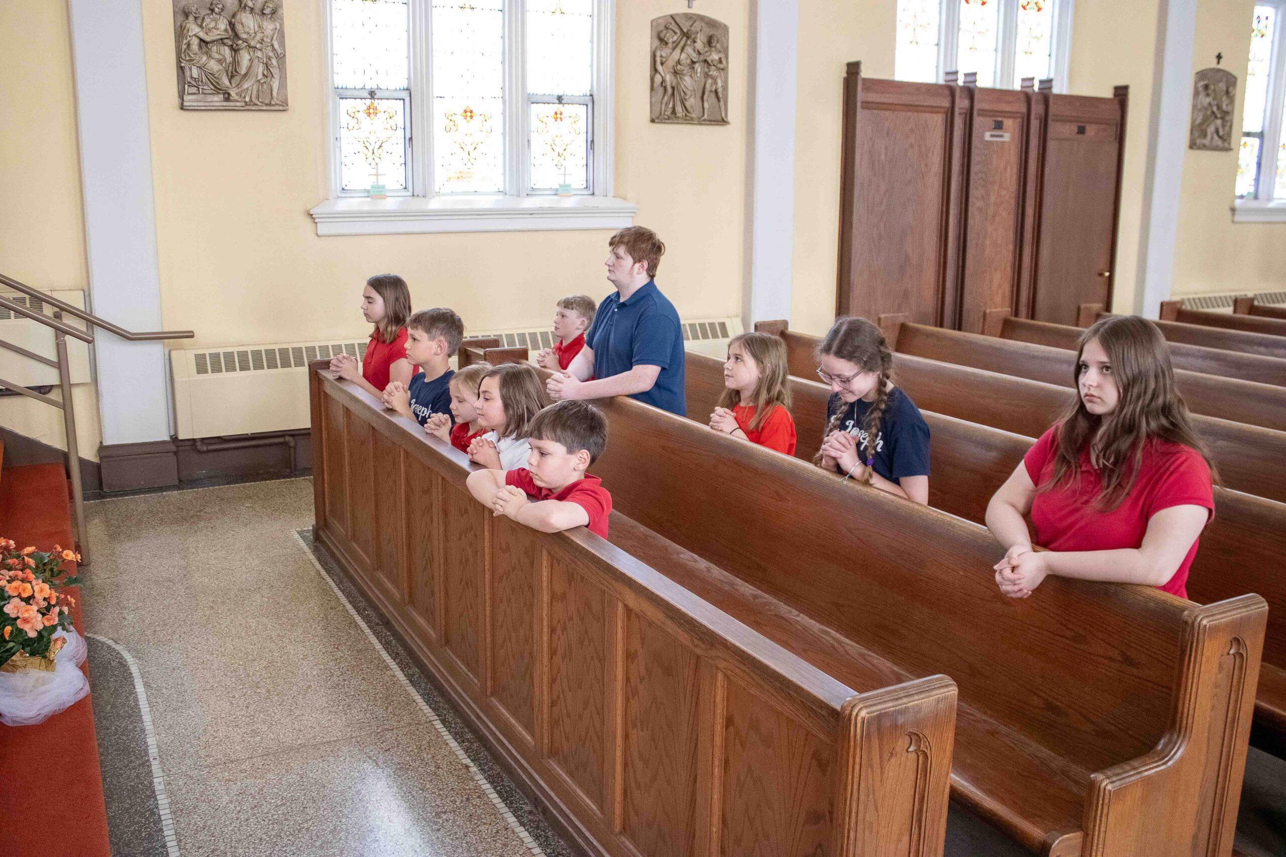 students praying at church